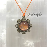 Pendant Necklace- peach holographic glitter resin with glass dome finish