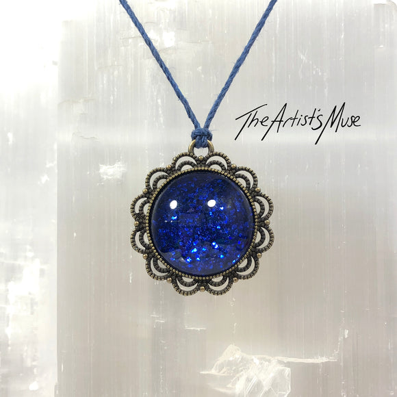Pendant Necklace- Deep blue glitter resin with glass dome finish