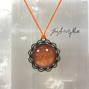 Pendant Necklace- Burnt orange glitter resin with glass dome finish