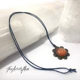Pendant Necklace- burnt orange glitter resin with glass dome finish