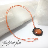 Pendant Necklace- Burnt orange glitter resin with glass dome finish